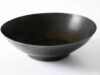 Essential Guide to Choosing the Perfect Wok: Features and Tips for Buyers _Seasoned carbon steel wok on gas stove illustrating materials and size selection for home cooking - ChopChic.com