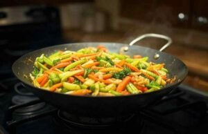 Silicone vs. Stainless Steel Wok Tools: Which is Safe for Seasoning? _Traditional carbon steel wok pan with deep sides for high-heat stir-frying - ChopChic.com