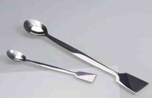 Why Are Chemical Spatulas So Popular? Chemical? Stainless steel chemical lab spatula being used by chef for precision plating of microgreens - ChopChic.com