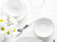 White Ceramic-Handled Set Review _White ceramic-handled cutlery set arranged on a linen napkin for an effortless aesthetic look - ChopChic.com