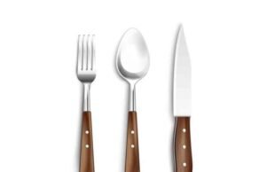 How Do Handcrafted Cutlery Sets Affect People? Rustic wood-handled fork and spoon set styled for a cozy Scandinavian kitchen dining table - ChopChic.com