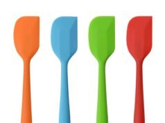 Reviewing the Best Silicone Spatulas for Your Kitchen (Rubber Scrapers) Stylish heat resistant rubber scraper spatula scraping batter from a bowl - ChopChic.com
