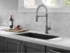 A Review of OWOFAN Kitchen Faucet, One of Amazon’s Most Popular Products OWOFAN kitchen faucet with pull down sprayer installed in modern kitchen sink review - ChopChic.com