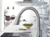 Grohe Zedra Supersteel Faucet Review: The Pros and Cons _Grohe Zedra Supersteel kitchen faucet with pull-down spray in a modern sink setting - ChopChic.com