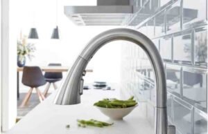 I Have to Make a Choice for My Kitchen: Matte Black Faucets or Chrome Faucets? _Grohe Zedra Supersteel kitchen faucet with pull-down spray in a modern sink setting - ChopChic.com