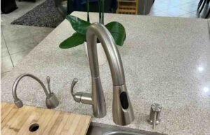 Things to Do Before Buying the Moen Essie MotionSense Faucet -Waving hand over Moen Essie MotionSense faucet to test touchless activation sensitivity - ChopChic.com