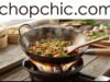 Adapting Recipes for Your Carbon Steel Wok: Tips for Best Results _Fresh vegetables, aromatics, and marinated meat sizzling in a carbon steel wok over high heat, showcasing the best ingredients for stir-frying.