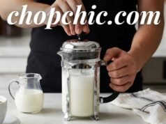 Can You Froth Milk with a French Press? _A person pumping the plunger of a French press to create thick milk foam for a homemade latte, demonstrating an easy frothing method without an espresso machine.