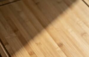 Top 5 Ways to Safely Disinfect Bamboo Cutting Boards Without Using Bleach _Hand washing a bamboo cutting board with mild soap and warm water to prevent warping - ChopChic.com