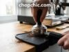The Importance of a Tamping Mat in Your Espresso Setup _A black silicone espresso tamping mat placed on the counter edge, protecting the surface and stabilizing the portafilter during tamping for consistent pressure.