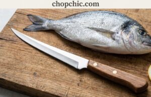 A Fisherman’s Guide to the Best Fillet Knives _A close-up of a highly flexible fillet knife blade bending against the spine of a fresh fish, demonstrating how the steel contours to the bone structure to maximize meat yield.