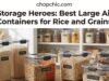 Bulk Storage Heroes: Best Large Airtight Containers for Rice and Grains _A stack of black plastic bulk meal prep containers showing a cracked corner, highlighting durability and microwave safety issues discussed in forums.