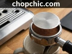 Do You Need a Puck Screen? The Truth About Cleaner Shower Screens and Even Extraction _A close-up of a stainless steel espresso puck screen placed on top of tamped coffee grounds in a portafilter, illustrating its role in dispersing water and preventing coffee residue on the group head.