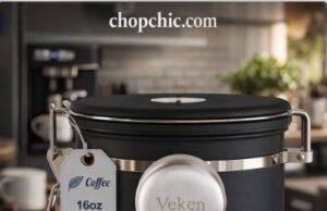 The Amazon King: Is the Veken Coffee Canister Actually Good? (Review) _A Veken stainless steel coffee canister with a date tracker on the lid and a side window, displaying stored coffee beans and the CO2 release valve mechanism.