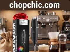 Zulay Milk Frother Review: The King of Handheld Whisks? _A close-up of a handheld Zulay Kitchen milk frother whisking hot milk into thick foam in a glass mug, demonstrating the motor speed and stainless steel whisk design.