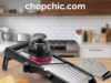 BINGBING Adjustable Mandoline Review: A Heavy-Duty Slicer for Bulk Prep? _A close-up of the BINGBING Adjustable Mandoline showing the side-mounted rotary dial for adjusting thickness, alongside the included pair of gray cut-resistant gloves, highlighting the safety-focused design.