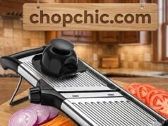 Gramercy Adjustable Mandoline Review: Is Stainless Steel Worth the Upgrade? _A user wearing grey cut-resistant gloves slicing potatoes on the stainless steel Gramercy Adjustable Mandoline, highlighting the rigid metal frame and the lack of flexing during bulk food preparation.