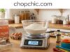 Best Kitchen Scale for Baking: 4 Honest Picks A side-by-side kitchen counter display comparing a set of traditional metal measuring cups with four digital food scales, prominently featuring a classic two-button Escali Primo model and a stainless steel OXO 11 lb scale with its pull-out display extended, surrounded by baking ingredients.