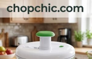 Farberware Pump Salad Spinner Review: The 1-Handed Fix A large, clear plastic Farberware 6.6-quart salad spinner resting on a wooden kitchen island, showing a single hand pushing down on the central vertical pump mechanism, causing the internal green colander basket to blur from high-speed rotation, with the built-in brake button visible on the lid.