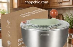 Lunememo Salad Spinner Review: Premium vs. Plastic A sleek Lunememo 5.3-quart stainless steel salad spinner resting on a granite kitchen counter, featuring a clear plastic lid with a hand-crank rotary handle and an instant stop button, while its silicone non-slip base grips the surface next to a pile of freshly washed lettuce.