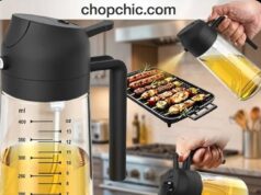 TrendPlain 16oz Glass Oil Sprayer Review: The Dual-Action Heavyweight A clear glass TrendPlain 2-in-1 oil dispenser resting on a kitchen counter next to a cast iron skillet, closely detailing its dual-action plastic lid that features both an ergonomic spray trigger and a gravity-fed pour spout with an automatic flip-cap.