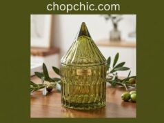 YILUSHENGHUA Colorful Glass Jar Review: Beautiful on the Counter, Honest About the Lid _A decorative, embossed YILUSHENGHUA glass jar filled with shortbread cookies resting on a wooden kitchen counter, prominently featuring its matching glass lid sitting loosely on the rim without a silicone airtight gasket.