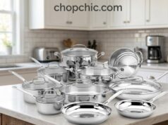 Cuisinart 17-Piece Stainless Steel Cookware Set Review A comprehensive 17-piece Cuisinart stainless steel cookware set arranged systematically on a kitchen island, prominently displaying its polished exterior finish, tempered glass lids, and the thick, encapsulated aluminum-core base of an overturned frying pan.