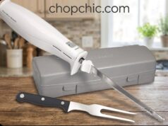Hamilton Beach Electric Knife Review: The Ultimate Carving Multi-Tool A close-up of a stainless steel Hamilton Beach electric knife effortlessly gliding through a thick, crusty sourdough loaf on a wooden cutting board, specifically highlighting the dual reciprocating serrated blades in motion.