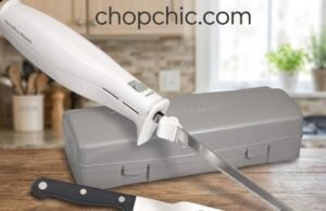 Hamilton Beach Electric Knife Review: The Ultimate Carving Multi-Tool A close-up of a stainless steel Hamilton Beach electric knife effortlessly gliding through a thick, crusty sourdough loaf on a wooden cutting board, specifically highlighting the dual reciprocating serrated blades in motion.
