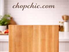 John Boos R-Board Review: The Ultimate Wood Cutting Board Standard A massive, edge-grain maple wood John Boos R-Board cutting board resting firmly on a professional kitchen counter, featuring its signature reversible design and thick, heavy-duty profile alongside a freshly sharpened chef's knife.