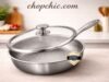 Plateful Titanium Pan Review: The Truth About “Uncoated Non-Stick” A sleek, uncoated Plateful pure titanium frying pan resting on a modern stovetop, featuring a perfectly fried egg releasing effortlessly from its bare metal surface to visually demonstrate its natural non-stick properties.