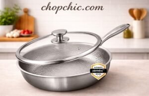 Plateful Titanium Pan Review: The Truth About “Uncoated Non-Stick” A sleek, uncoated Plateful pure titanium frying pan resting on a modern stovetop, featuring a perfectly fried egg releasing effortlessly from its bare metal surface to visually demonstrate its natural non-stick properties.