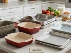 Best Non-Toxic Baking Pans: The Ultimate Guide to Safe Bakeware A comparative photograph taken in an artisan bakery kitchen, showcasing three fresh baked goods emerging from a brick oven. A stainless steel pan holds roasted root vegetables, a glazed ceramic loaf pan contains a sourdough loaf, and a carbon steel pie dish holds an apple tart, illustrating non-toxic baking options.