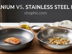 Titanium vs. Stainless Steel Pan: Which One Should You Buy? A side-by-side comparison on a modern stovetop featuring a sleek, dark-grey titanium skillet next to a heavy-gauge, polished stainless steel frying pan, both displaying completely uncoated, toxin-free cooking surfaces.