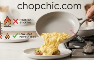 The Best Non-Toxic Pan for Scrambled Eggs: 3 Picks That Actually Slide A detailed close-up photograph taken in a modern kitchen, capturing a chef's hand tilting a light-gray ceramic-coated non-stick frying pan, revealing a perfect, cohesive stream of soft, creamy scrambled eggs sliding flawlessly onto a white ceramic plate. The text "chopchic.com" is overlayed across the top in a clean, sans-serif font. To the left, a stylized diagram with a flame and a temperature gauge contrasts a high flame with a red X and "HIGH HEAT: STICKING" against a low flame with a green checkmark and "LOW HEAT: PERFECT SLIDE," referencing the heat control secret. Natural, warm light illuminates the scene, emphasizing the non-stick surface and fluffy eggs.
