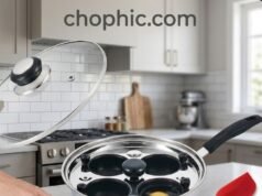 Eggssentials 4-Cup Poacher Review: Professional Performance for Every Stovetop A detailed view of the gleaming stainless steel Eggssentials 4-Cup Poacher pan situated on a kitchen stovetop. The clear, vented glass lid covers four individual non-stick, PFOA-free poaching cups, emphasizing the pan's thick, 3-ply encapsulated base designed for even heat distribution.