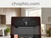 Instant Pot Vortex Plus 6QT Air Fryer Review: The ClearCook Material Analysis A technical infographic photograph analyzing the Instant Pot Vortex Plus 6QT Air Fryer on a modern quartz kitchen countertop. Perspective is eye-level, slightly angled. Features several callout text elements with clean lines and icons, as if on a review screen. The main subject, the Instant Pot Vortex Plus 6QT, is front and center. Its ClearCook window is illuminated, showing golden-brown French fries actively cooking inside. Integrated seamlessly on a glass panel backsplash is a website watermark.
